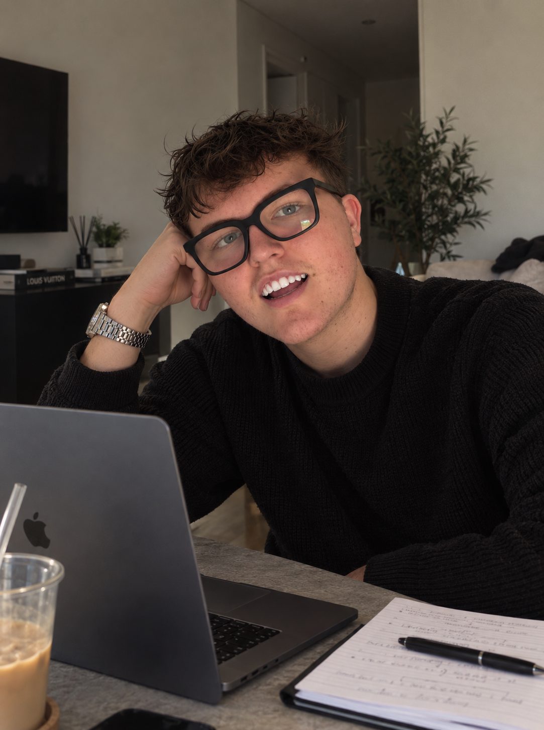 Jarvis smiling at his desk